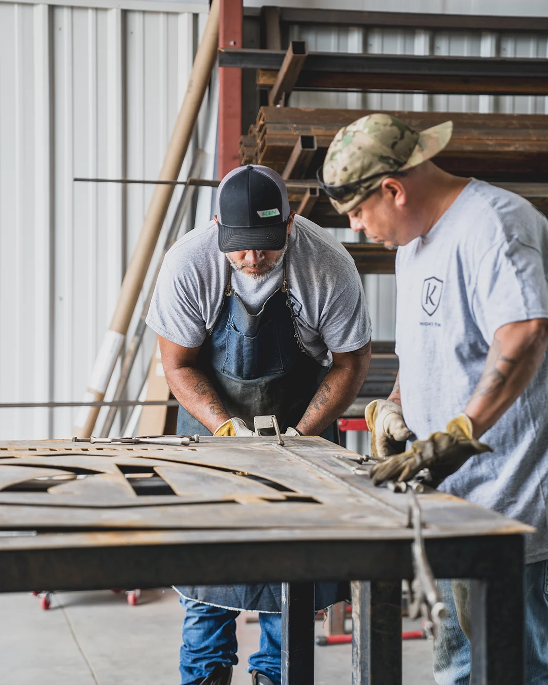 Knight Fire technicians fabricating custom fire suppression systems in the company's manufacturing facility.